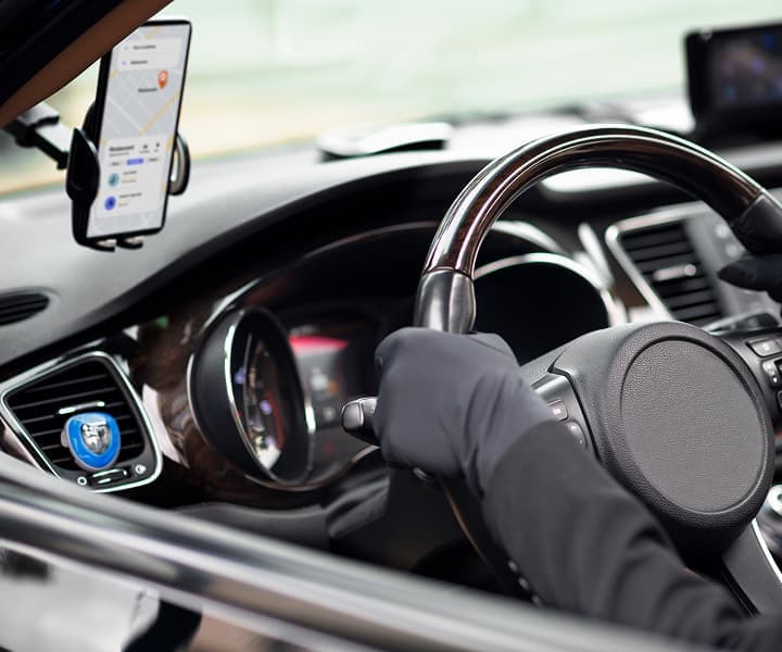 Taxi booking app dashboard displayed in car interior